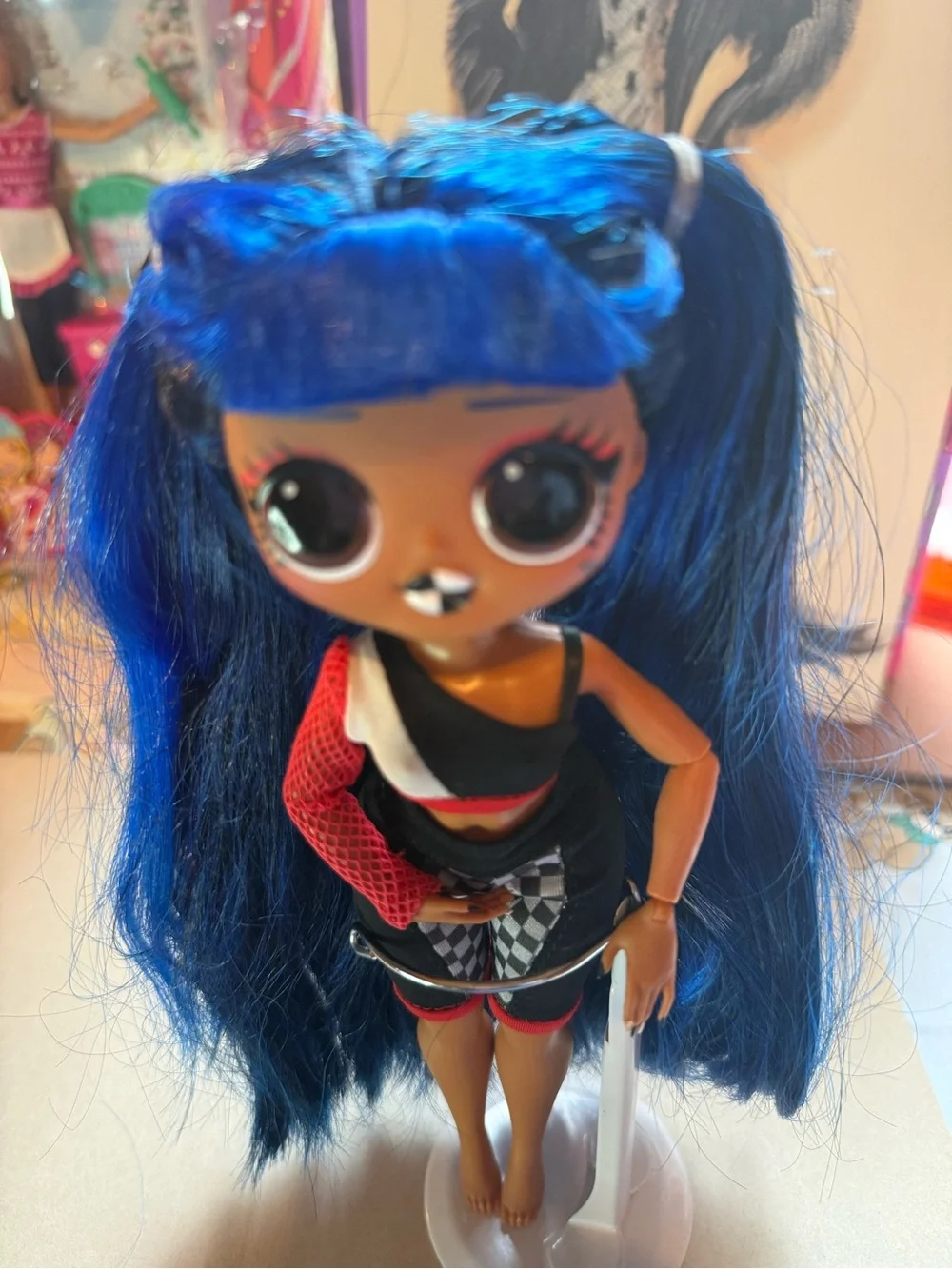 L.O.L. Doll with Vibrant Blue Hair and Black-Red Outfit